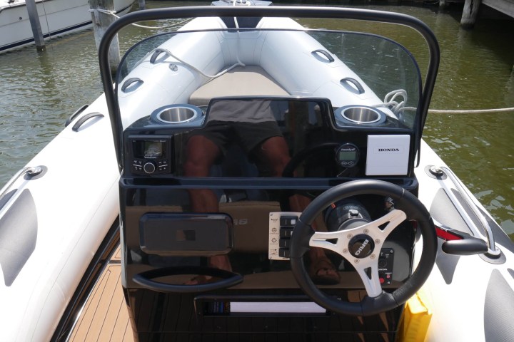 a photo of a boat's steering wheel