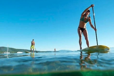 a person riding a paddleboard in the water