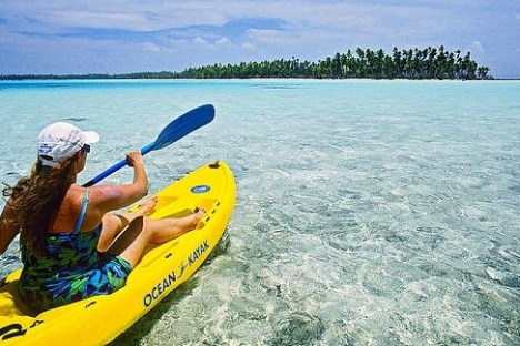 a person riding a kayak on a body of water